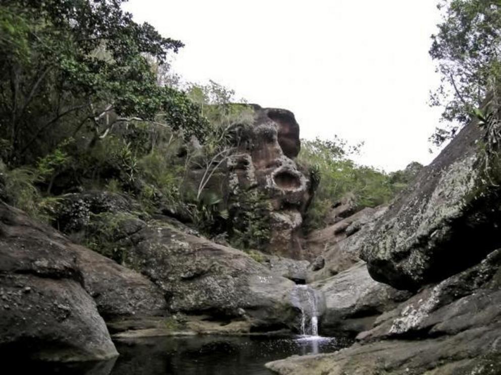 Massive carved-stone face of Taino god Cohoba.