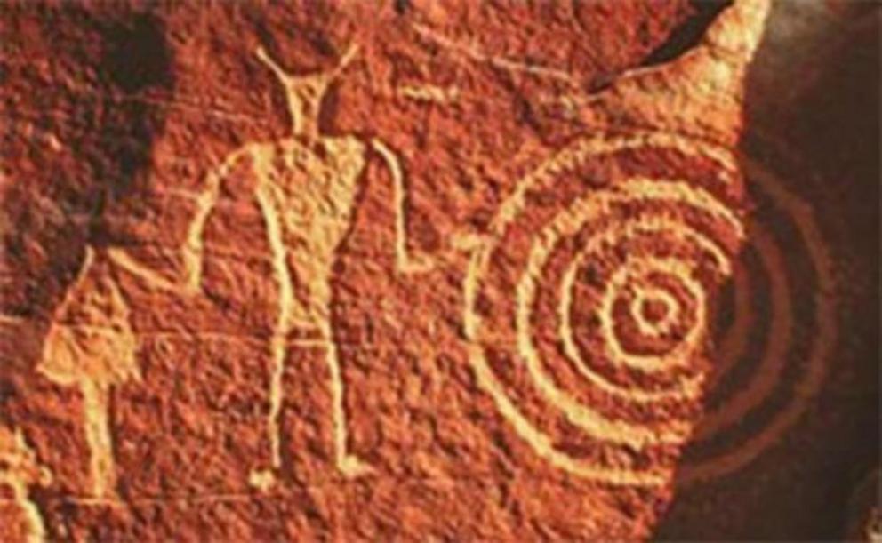 Classic Vernal Style petroglyph by Fremont culture, Utah. With its anthropomorphic trapezoidal torso and broad shoulders with a narrow waist it may be susceptible to the pseudoscientific, Ancient Astronaut Theory.