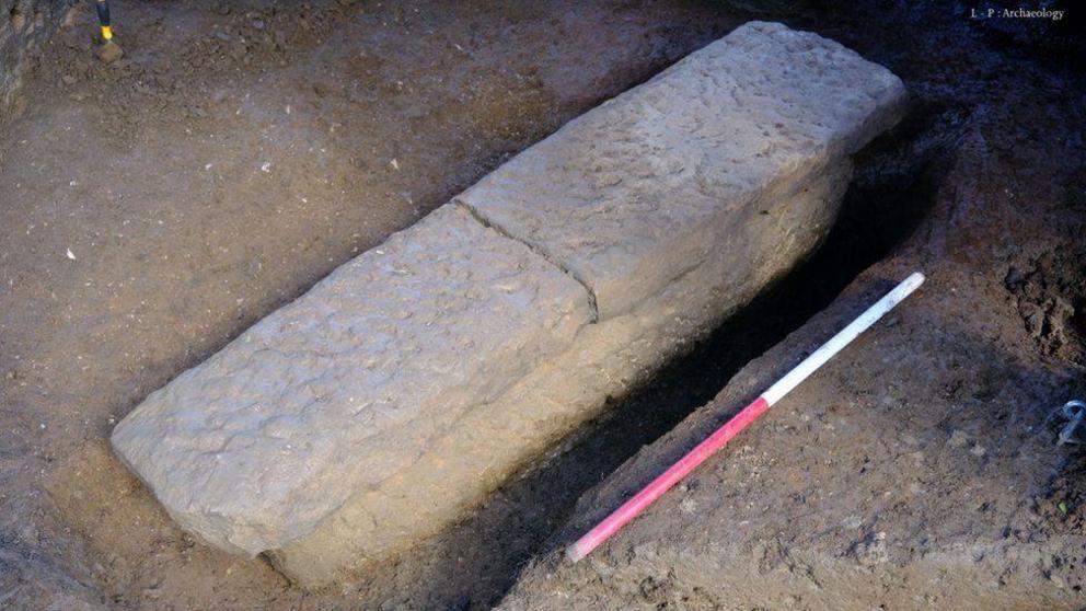 The stone coffin was found with the remains of two people inside. image copyrightL-P Archaeology