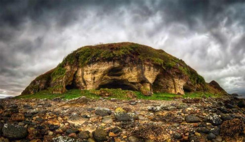 The chambered cairns of Drumadoon Point are not far from the King's Caves of the Isle of Arran, which are pictured here from the outside.