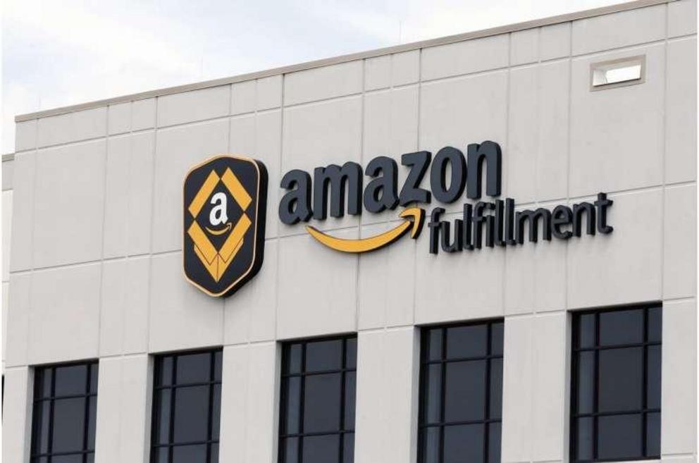 This July 8, 2019, file photo, shows the Amazon Fulfillment warehouse in Shakopee, Minn. Starting Monday, Aug. 9, 2021, Amazon will be requiring all of its 900,000 U.S. warehouse workers to wear masks indoors, regardless of their vaccination status. The m