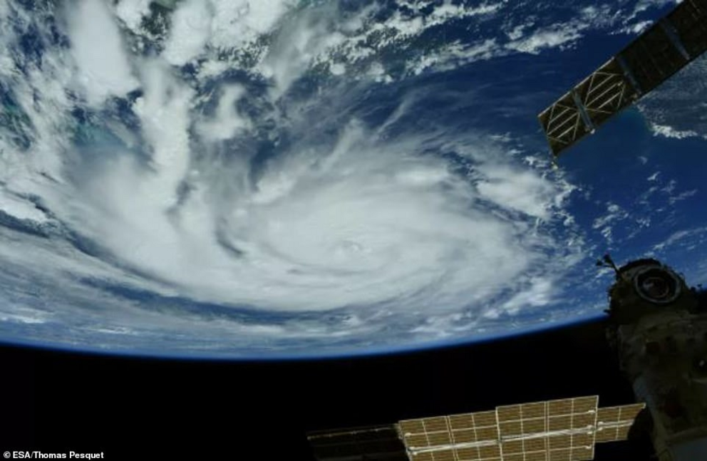 The hurricane can be seen amid the International Space Station's (ISS) solar arrays. The storm also flattened utility poles, toppled trees onto power lines and caused transformers to explode