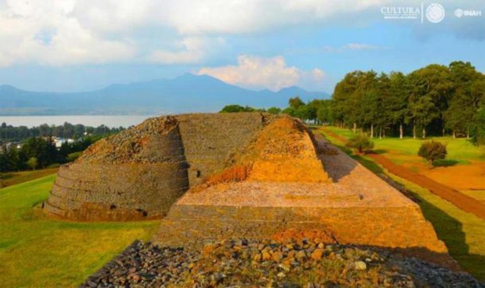 Detail of the Tzintzuntzan pyramid structures with Lake Pátzcuaro in the background.