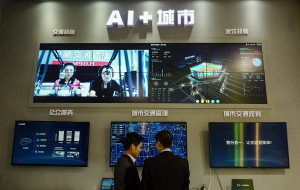 Visitors look at an AI smart city system by iFLY at the 2018 International Intelligent Transportation Industry Expo in Hangzhou in China’s eastern Zhejiang province in December 2018.