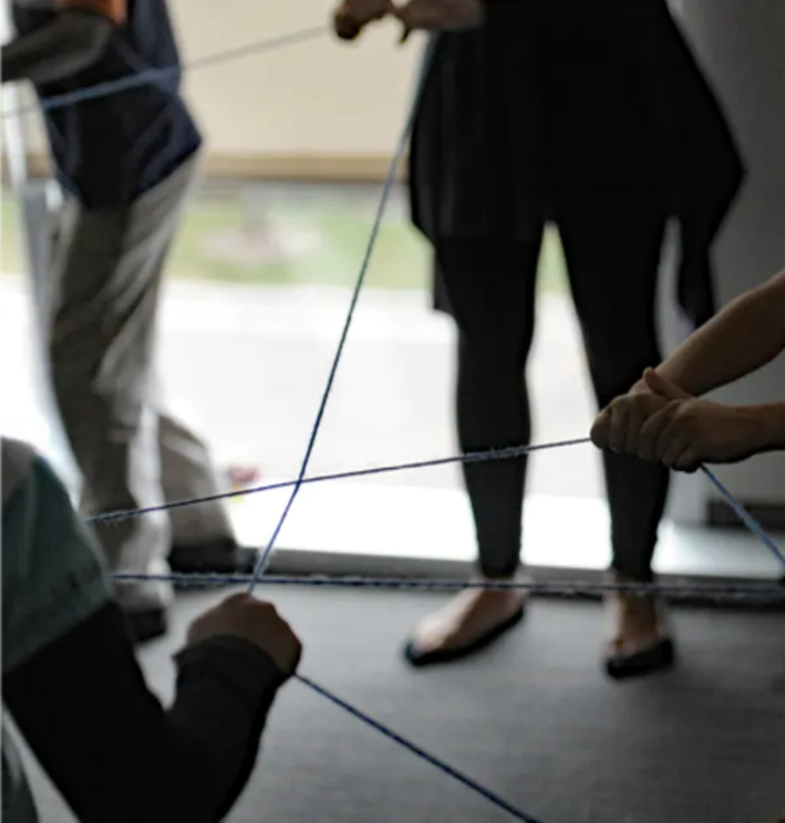 In this ice-breaker exercise, study participants created a dream catcher by tossing strings of yarn to one another, introducing themselves and then tossing the string to another child across the room.