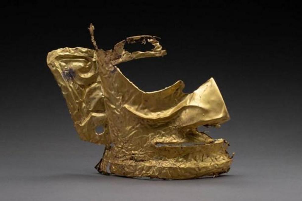 The partially destroyed golden mask unearthed in a sacrificial pit at the Sanxingdui ruins.