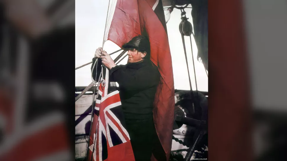 Alfred Cheetham, the third officer for Shackleton's Imperial Trans-Antarctic expedition (as it was known), prepares signal flags aboard the Endurance. Cheetham was experienced at Antarctic travel; Endurance Captain Frank Worsley called him 