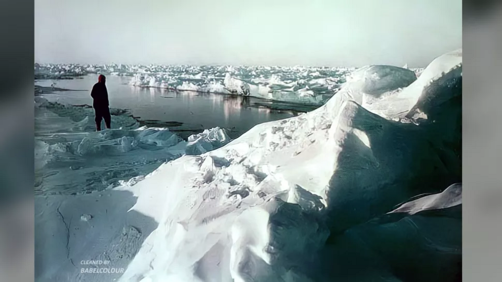 A crew member contemplates a lead in the ice during Shackelton's ill-fated expedition to the Antarctic. The spring breakup of the ice put the men in a difficult position. There was not enough open water to launch the lifeboats, but the ice was too soft an