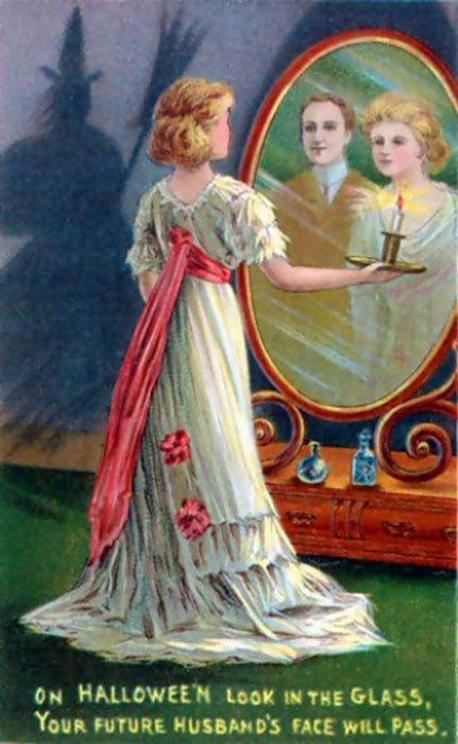 Early 20th century Halloween greeting card showing the legend of Bloody Mary, whereby a young girl will see her future husband reflected in a mirror.