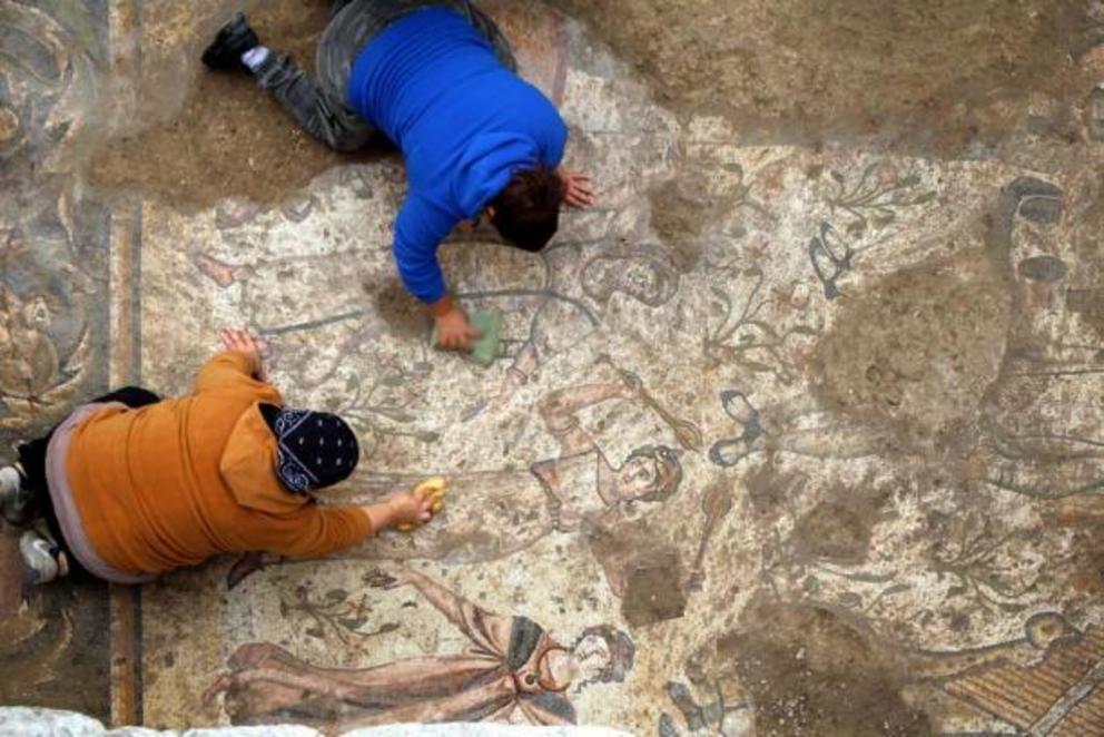 Archaeologists work on the Roman mosaic at the ancient city of Germanicia, Kahramanmara?, southern Turkey.