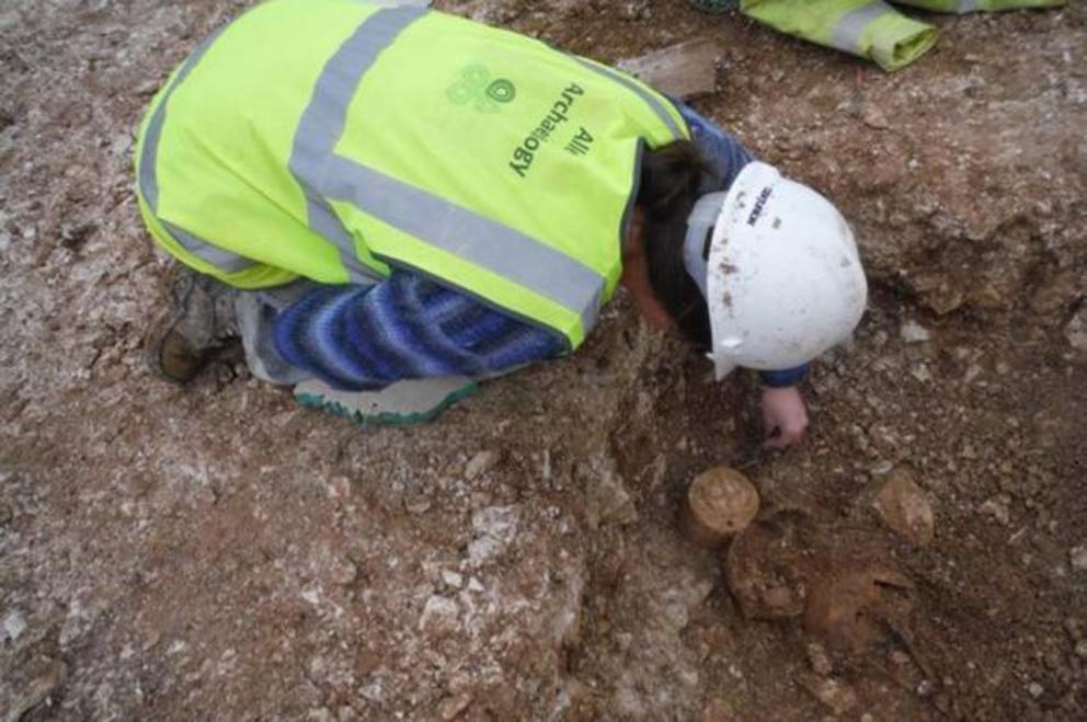 The Neolithic drum sculpture in situ being carefully excavated.