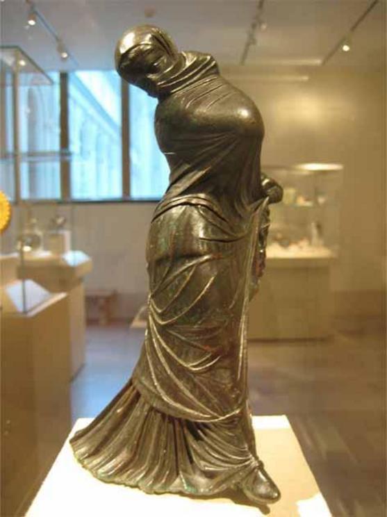 Bronze statuette of a veiled and masked dancer. Greek, 2nd–3rd century BC