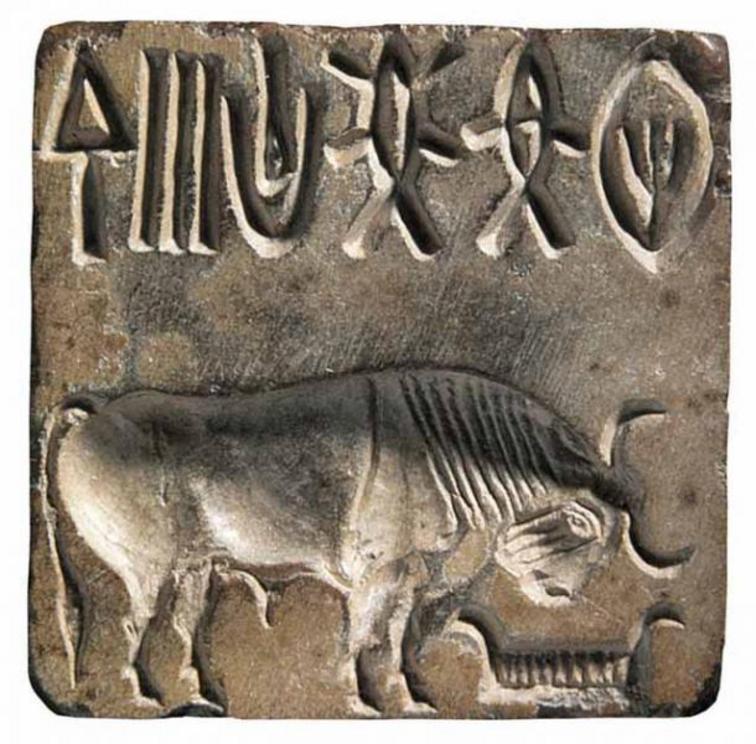 A stone seal from Mohenjo-Daro (Pakistan), similar to the ring found in Oman, with the same image of an Indian bison with the head lowered on a manger.