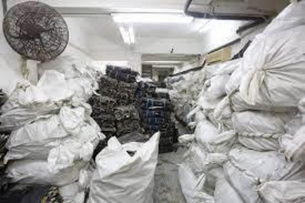 Sacks and bunches of shark fin, each weighing about 50 kg, are seen inside a Hong Kong shark fin trader’s warehouse in 2018.