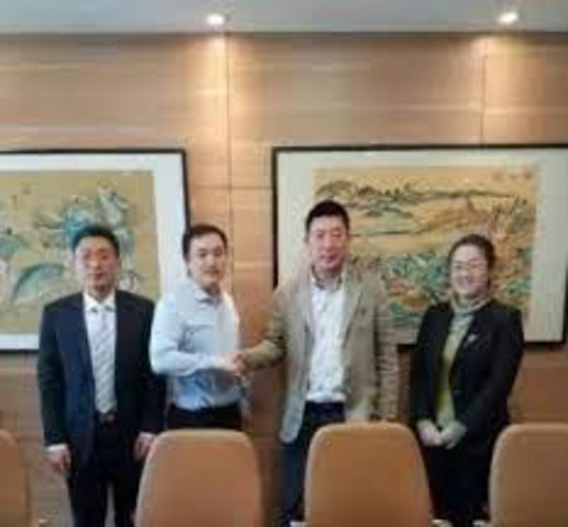 Li Zhenyu, second from right. Before founding DOF, he worked for HSBC bank in Dalian and ran an apparel export business.