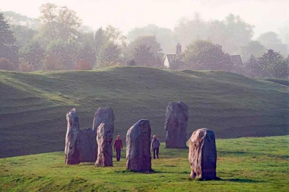 Avebury Stone Circle, Wiltshire, England. Ninety miles west of London and twenty miles north of Stonehenge stands Avebury, the largest known stone ring in the world. Older than the more famous Stonehenge, and for many visitors far more spectacular, the mu