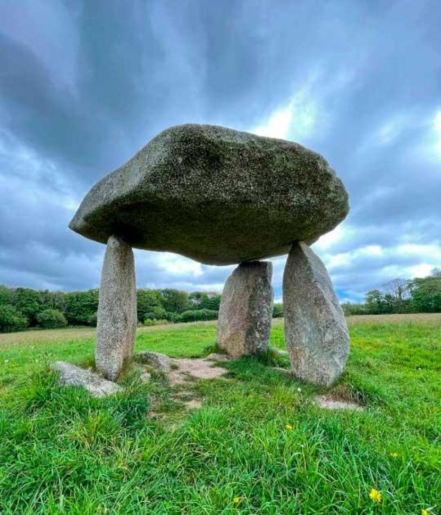 Carwynnen Quoit, Cornwall. The Carwynnen Quoit is an ancient dolmen which once sat in a field a few miles from the town of Camborne in Cornwall, in Southwest England.  The 5,000-year-old structure collapsed in 1967 but the ancient monument has been restor