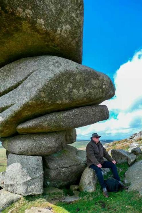 Cheesewring with scholar and author Paul Broadhurst, Cornwall. The Cheesewring is a granite tor in Cornwall, situated on the eastern flank of Bodmin Moor on Stowe's Hill. It is a natural geological formation, a rock outcrop of granite slabs formed by weat