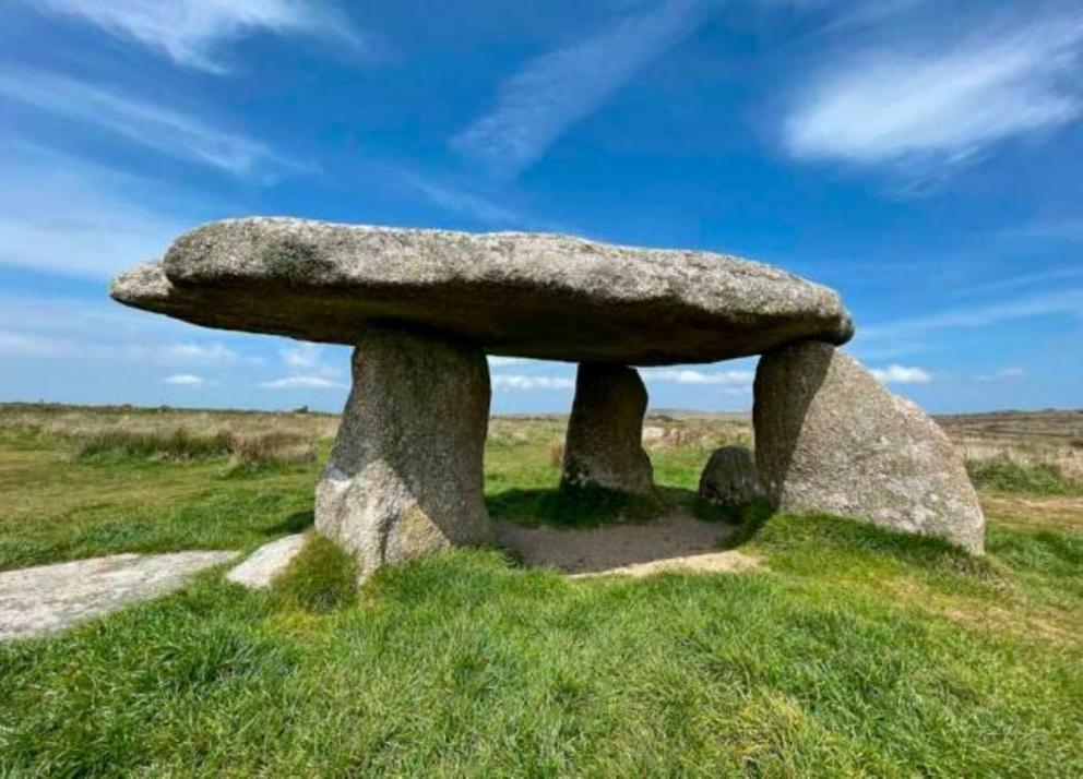 Lanyon Quoit, Cornwall. Lanyon Quoit is a dolmen in Cornwall, England, 2 miles southeast of Morvah. It collapsed in a storm in 1815 and was re-erected nine years later, and as a result the dolmen is now very different from its original appearance.