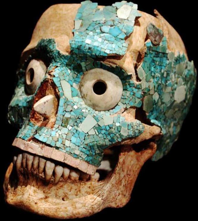 Mixtec funerary mask made with human skull and decorated with mosaics.