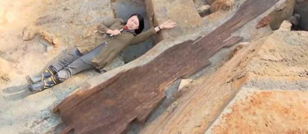 Reporter demonstrating the size of the haniwa statue.