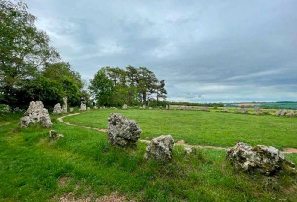 Rollright Stone Ring, Oxfordshire. The Rollright Stones is an ancient site located on the Oxfordshire & Warwickshire border in England. The complex consists of three main elements, The King's Men stone circle, the King Stone, and the Whispering Knights.