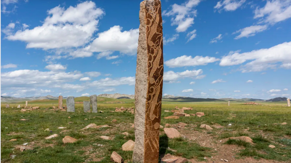 Several deer stones stand in the steppe of Mongolia near Moron. Image credit: Daan Kloeg/Shutterstock.com