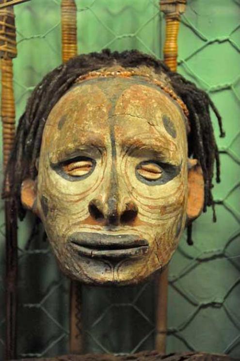 Decorated human skull, Sepik River, New Guinea.