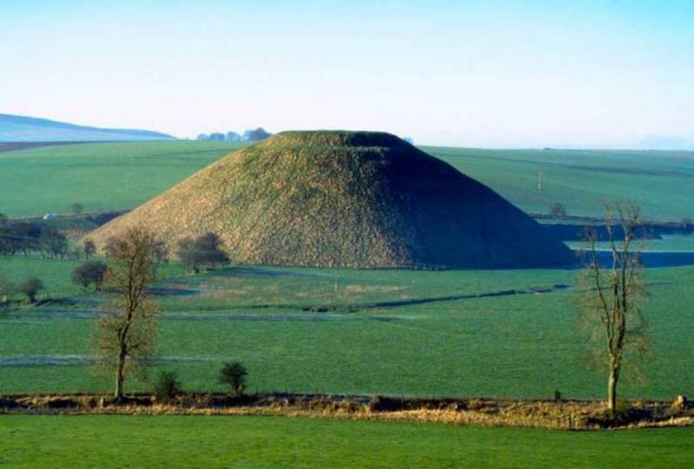 Silbury Hill, Avebury, Wiltshire. Silbury Hill is a prehistoric site located near Stonehenge and Avebury (a Neolithic henge monument) in the southwestern English county of Wiltshire. Silbury Hill has been measured to be 30 m (98.4252 ft.) tall and 160 m (