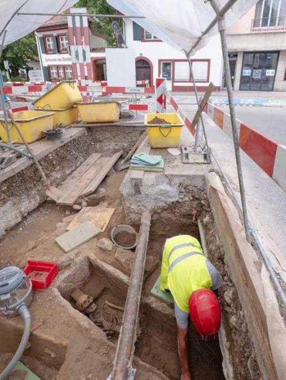 A man buried within an early medieval stone cist grave showed evidence of serious injury to his face thanks to a sword blow.