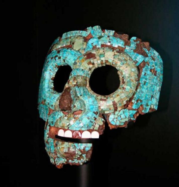 An Aztec or Mixtec skull mask of Quetzalcoatl, made of turquoise on top of human skull.
