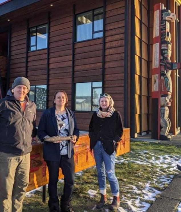 After it was determined that this was a rare Salish war club, the finder, Mark Lake (left), “returned” the artifact to its rightful owners, the K’omoks First Nation. Chief Nicole Rempel (middle) of the K’omoks First Nation proudly accepted the war club fr