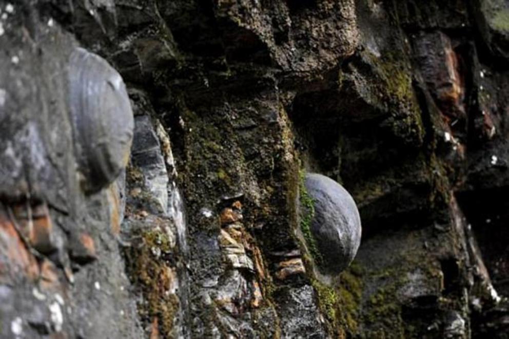 Geologists still don’t completely understand why these stone eggs appear from the Chan Dan Ya cliff in China.