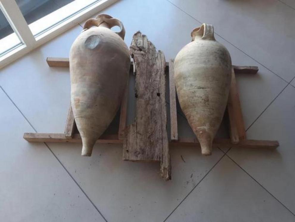 Two perfectly preserved amphora found on the Roman cargo ship that sank meters from a busy beach in Mallorca, Spain.