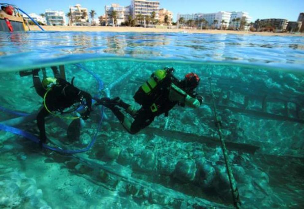 The Roman cargo ship and its well-preserved amphorae jars just below the sea surface and almost on the one of the busiest beaches in Spain.