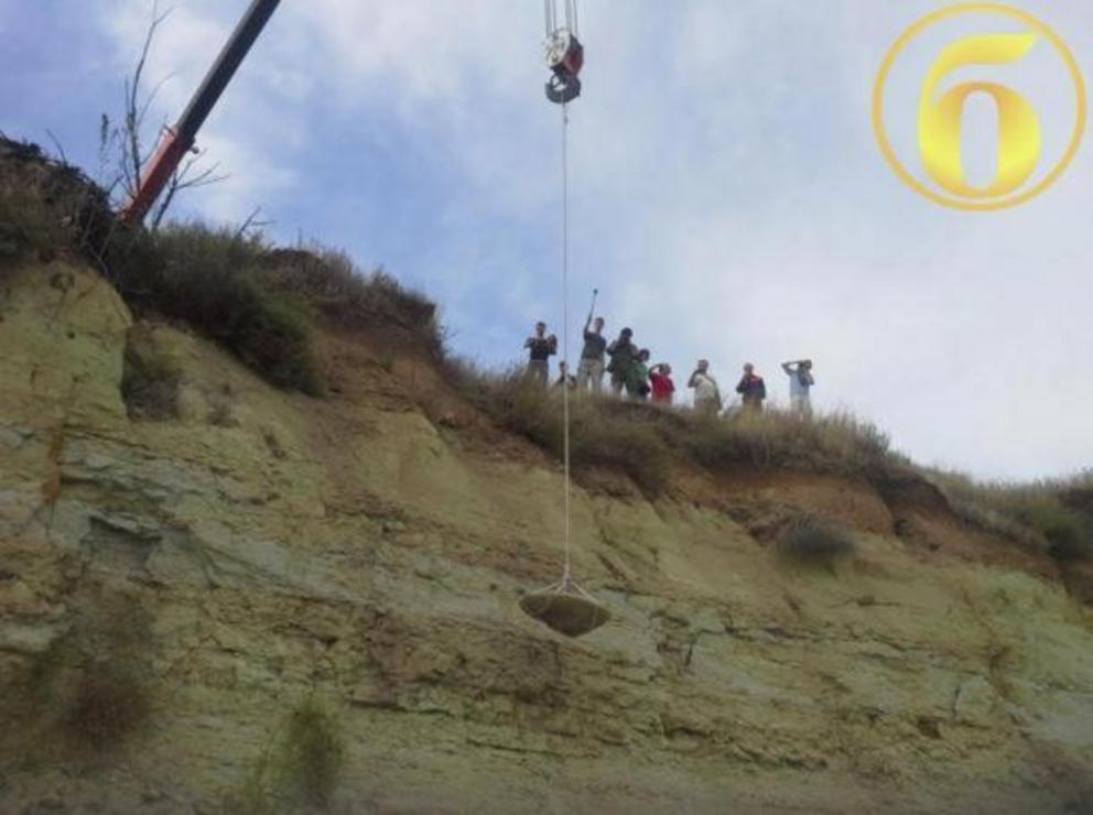 Large stone disc being lifted by a crane in Volgograd, Russia.