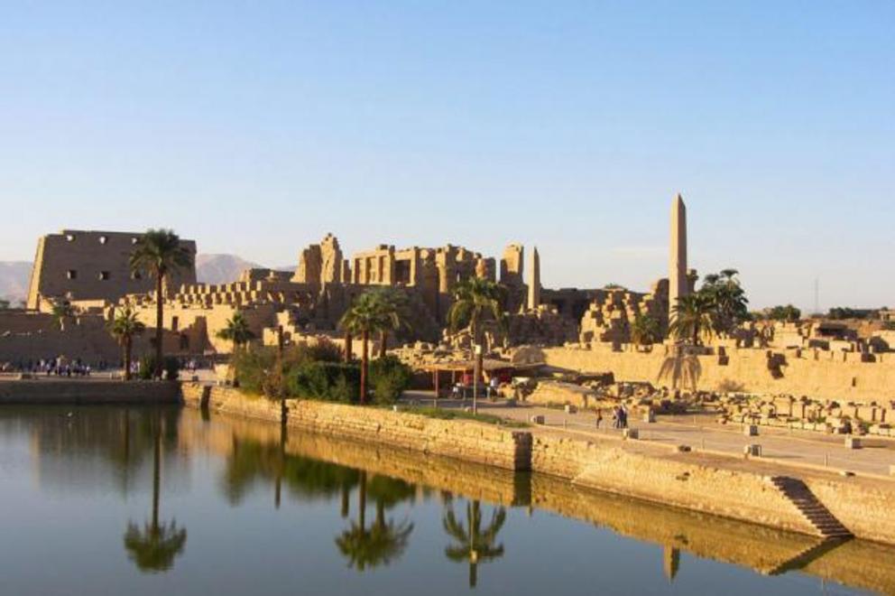 The Precinct of Amun-Re, the largest of the precincts of the Karnak Temple complex, as seen from the sacred lake in Luxor, where the Karnak obelisk dedicated to Queen Hatshepsut was recently re-erected.