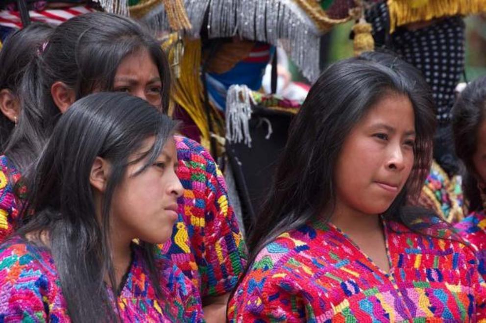 Young Maya women in traditional dress, Antigua Guatemala, Guatemala.