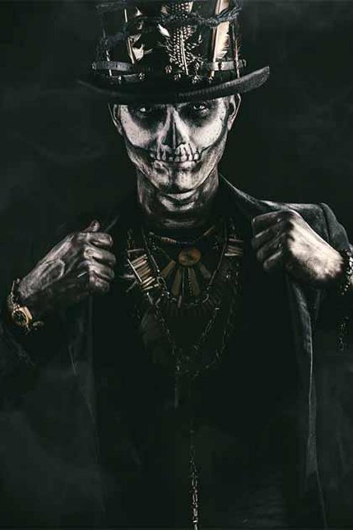 Baron Samedi is the head of the Ghede family of Loa, ruling over them with his wife, Maman Brigitte. Both figures are associated with the dead and the underworld.