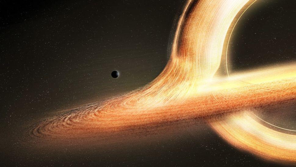 Monstrously huge black hole devours an Earth-size chunk of matter every ...