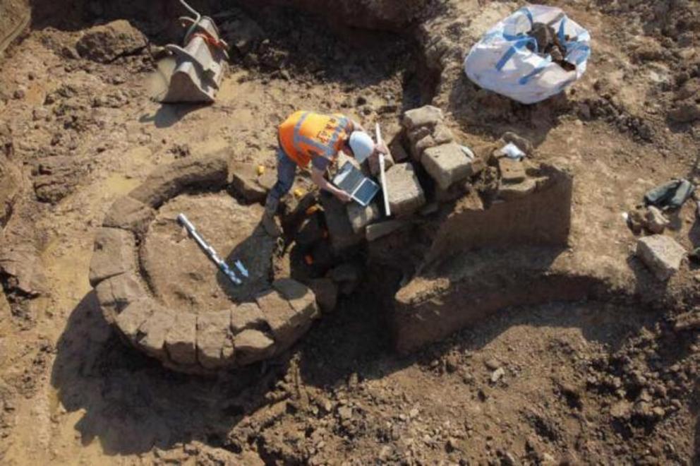 Unearthing the well next to the remains of two Roman temples that were recently discovered near the village of Herwin-Hemeling in the Netherlands.