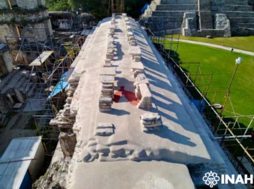 Final view of the finished restoration works on the roof of House D, with the area of red paint over painted.