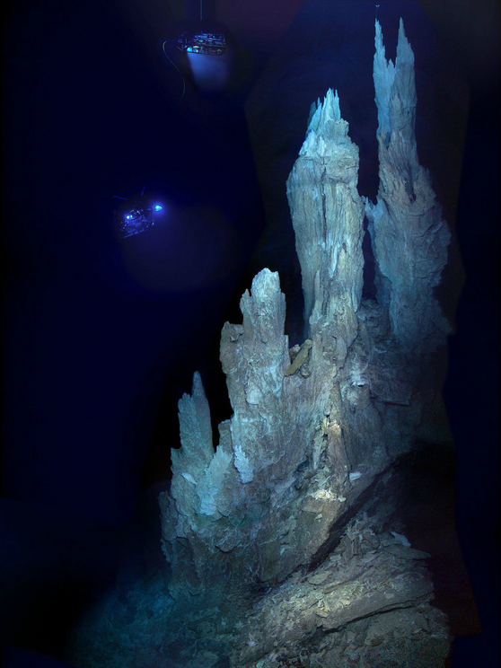 A remotely operated vehicle shines a light on the spires of the Lost City.