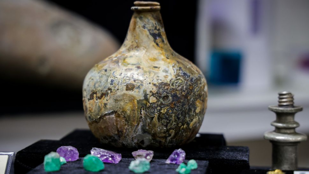 A glass wine bottle was one of the many day-to-day objects used by the ship’s crew.