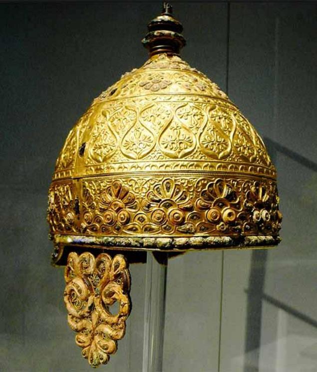 Celtic parade helmet, 350 BC. Found buried in a cave in Agris, western France. The entire cap, neck guard and cheek guards were all cluttered with lavish gold tendril and leaf design.