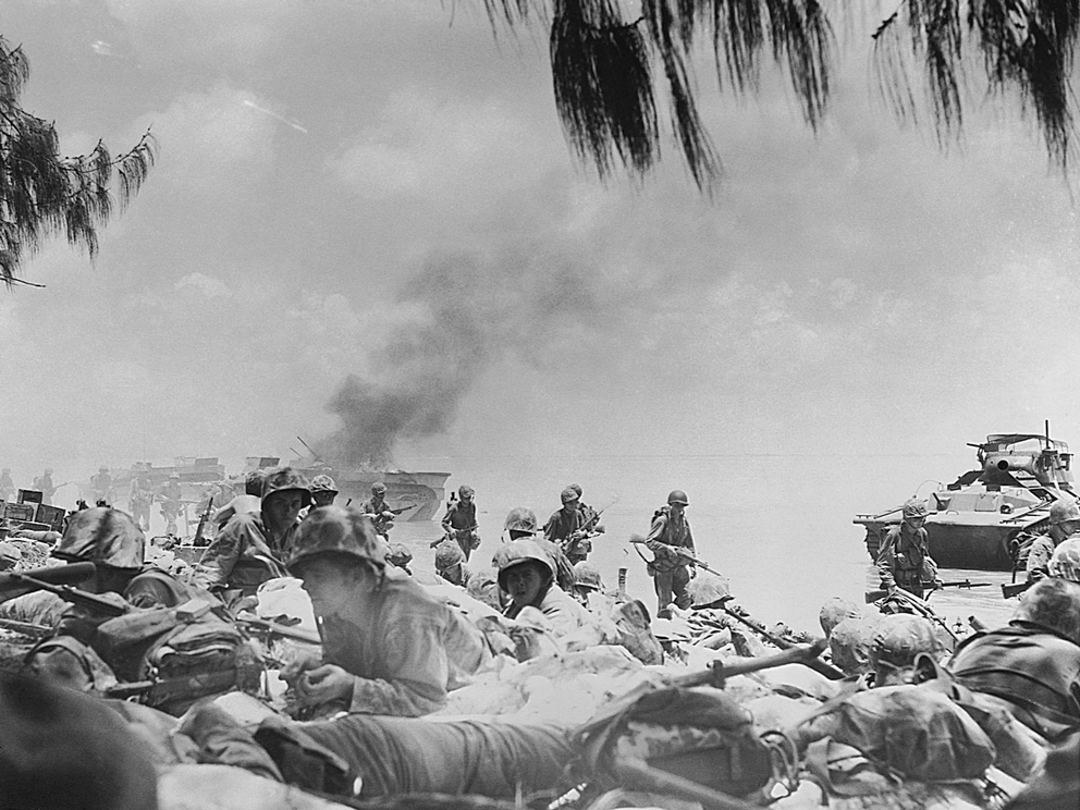 U.S. Marines land on the beach in Saipan on 24 June 1944 as part of an operation to capture the island.