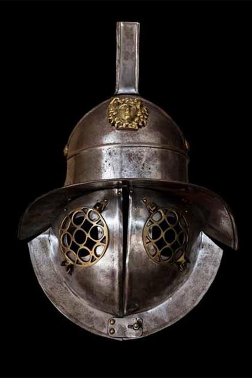 Murmillo gladiator helmet . The murmillo was a type of gladiator during the Roman Imperial age. The helmet of the murmillo had a broad brim, as well as a crest, which was adorned with plumes or horsehair. This crest would typically have a stylized fish on