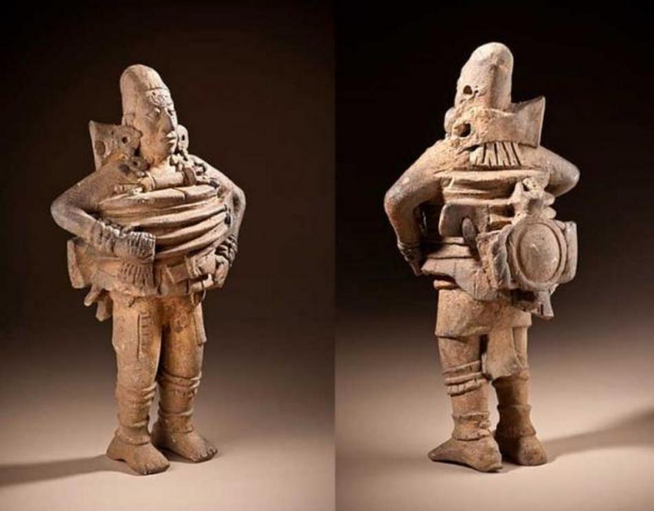 This figure from Guatemala, 500-850 AD, has been described as an ancient astronaut with oxygen tank and equipment. Historians say he is a ballplayer from the Peten region of Guatemala.