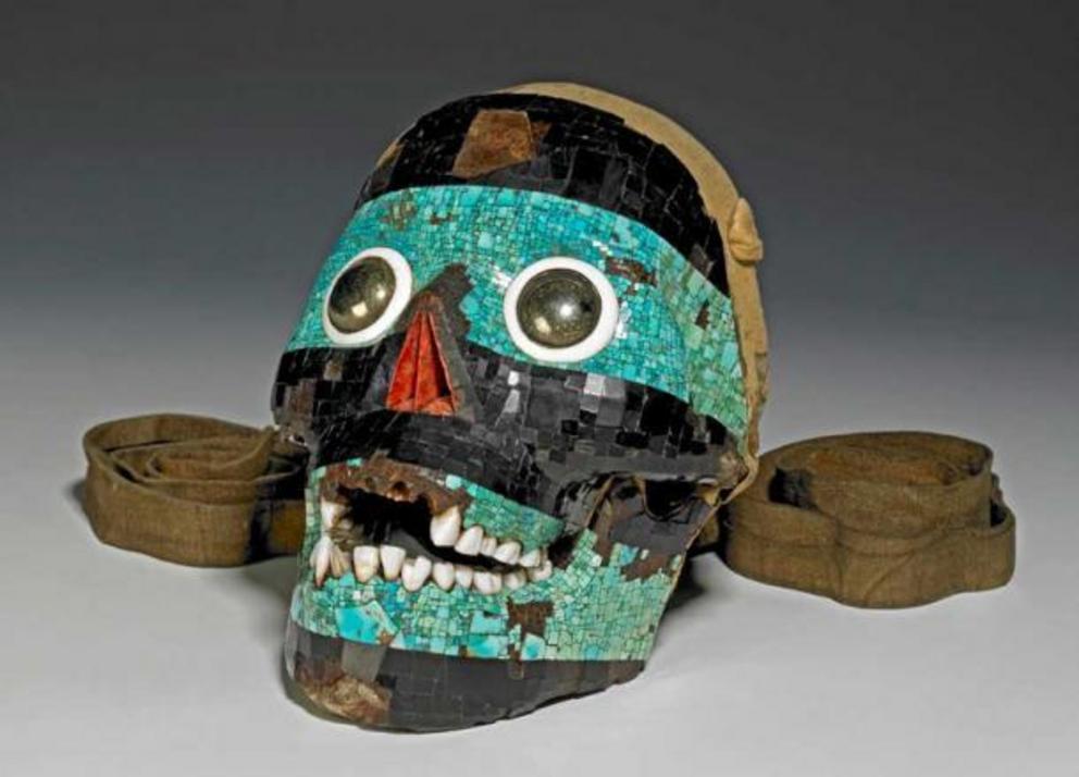 The mosaic skull mask of Tezcatlipoca is believed to represent  Tezcatlipoca, a.k.a. “Smoking Mirror,” one of the four powerful and influential creator gods of Aztec mythology. This Aztec artifact is actually a human skull covered with a mosaic of  turquo