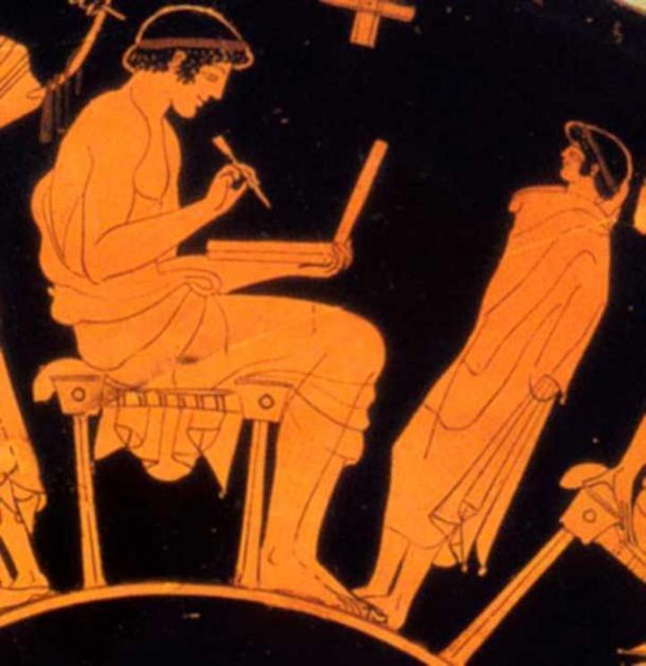 Close-up of a red figure vase by Greek painter Douris (c. 500 BC) appears to depict a figure holding a laptop with a stylus. Historians say it is just a wax tablet.